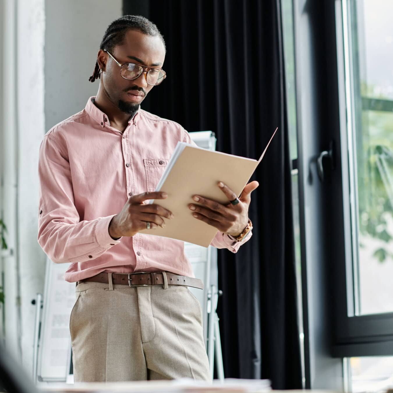 A man looks at a tablet to learn more about the ICF Foundation Chapter Community