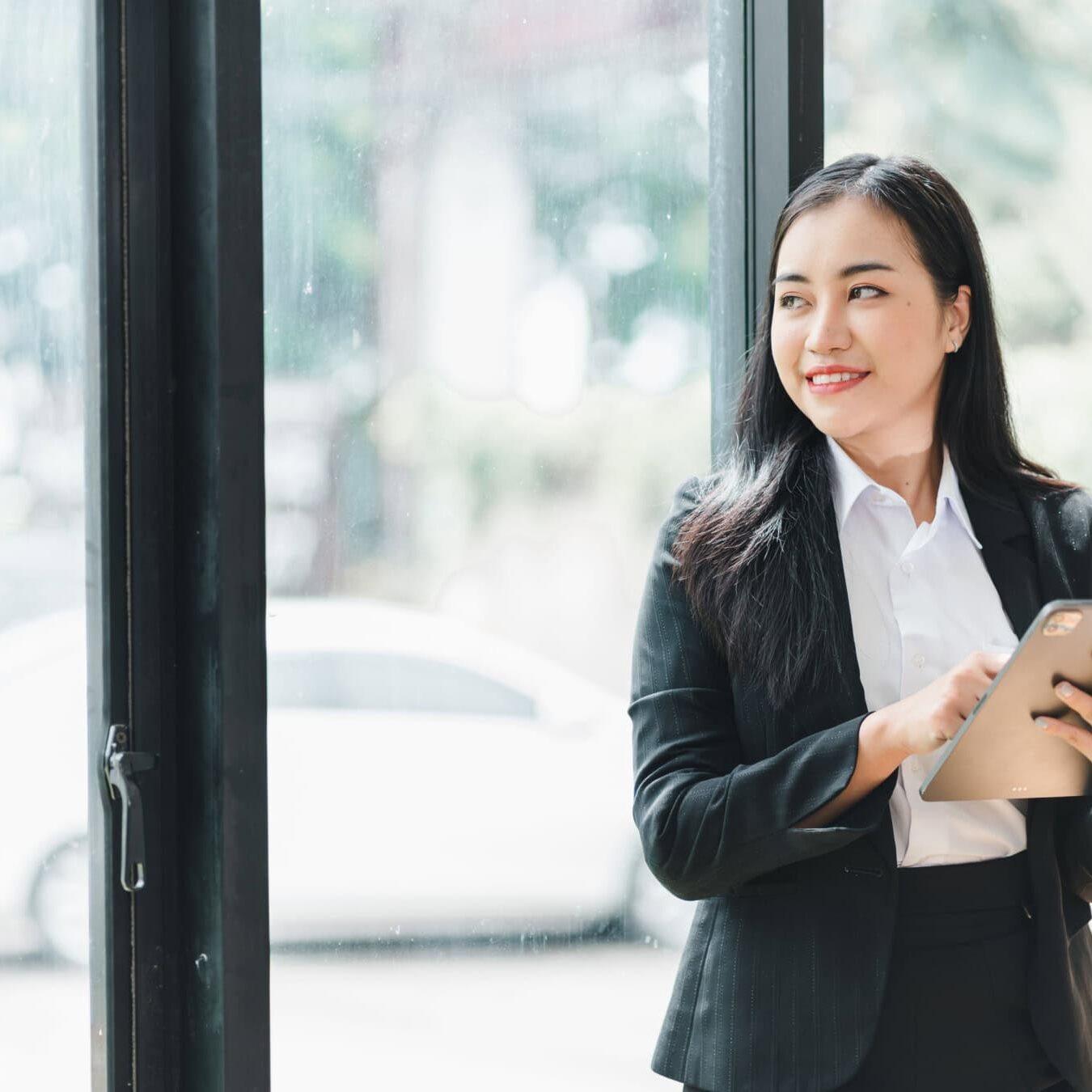 Woman reviews iPad to look at the next steps after taking her ACC Exam