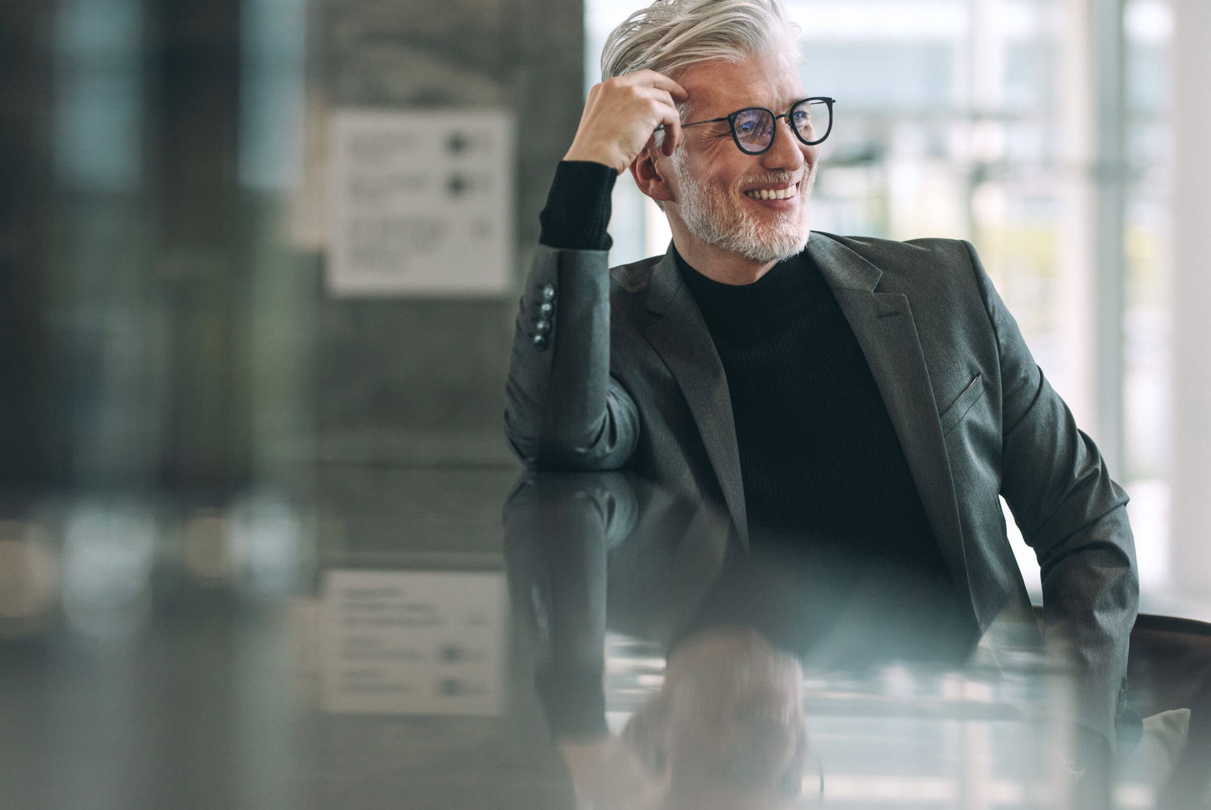 An older professional man advanced to his ICF Master Certified Coach (MCC) credential