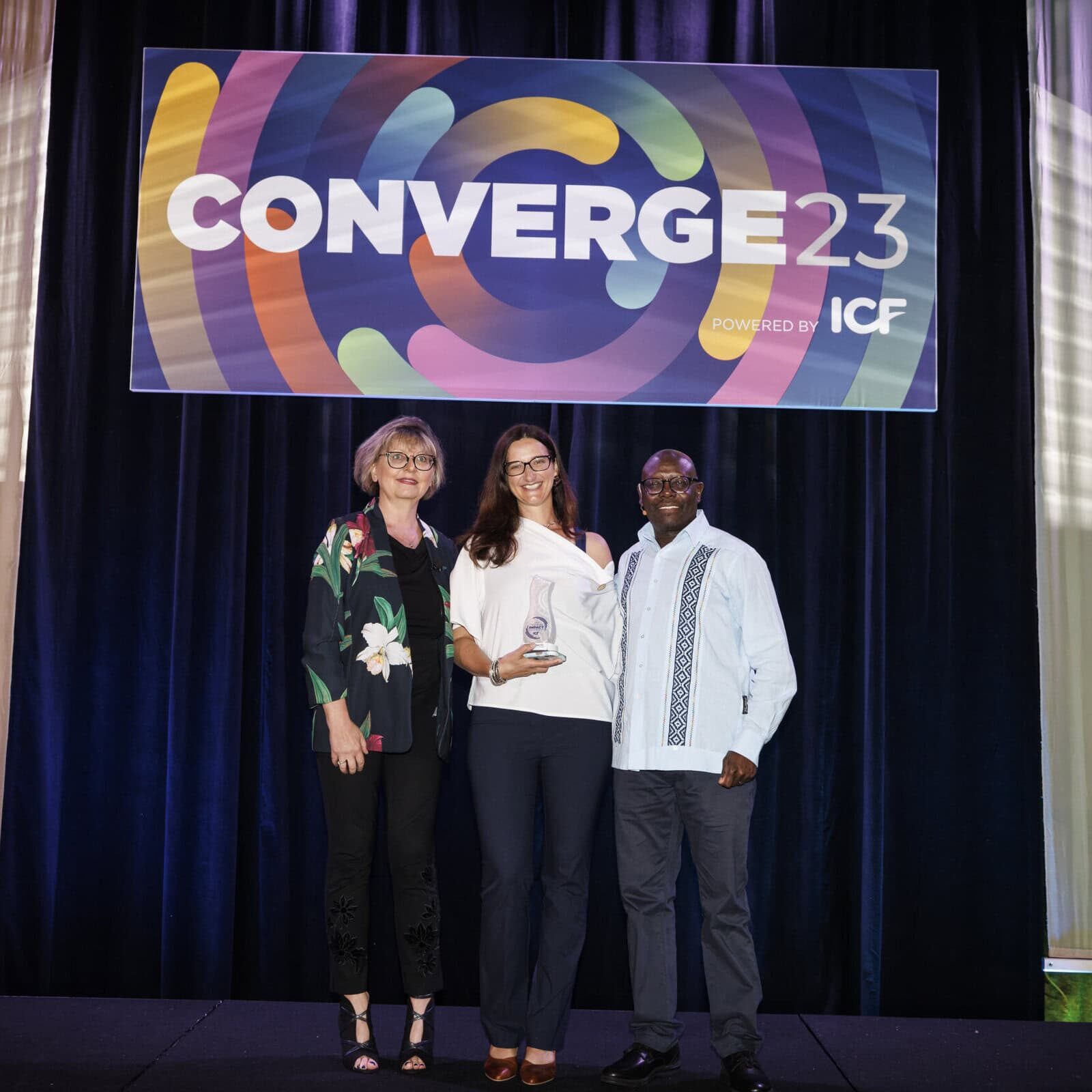 ICF Awards Gala attendees raising a toast to celebrate achievements in the coaching industry