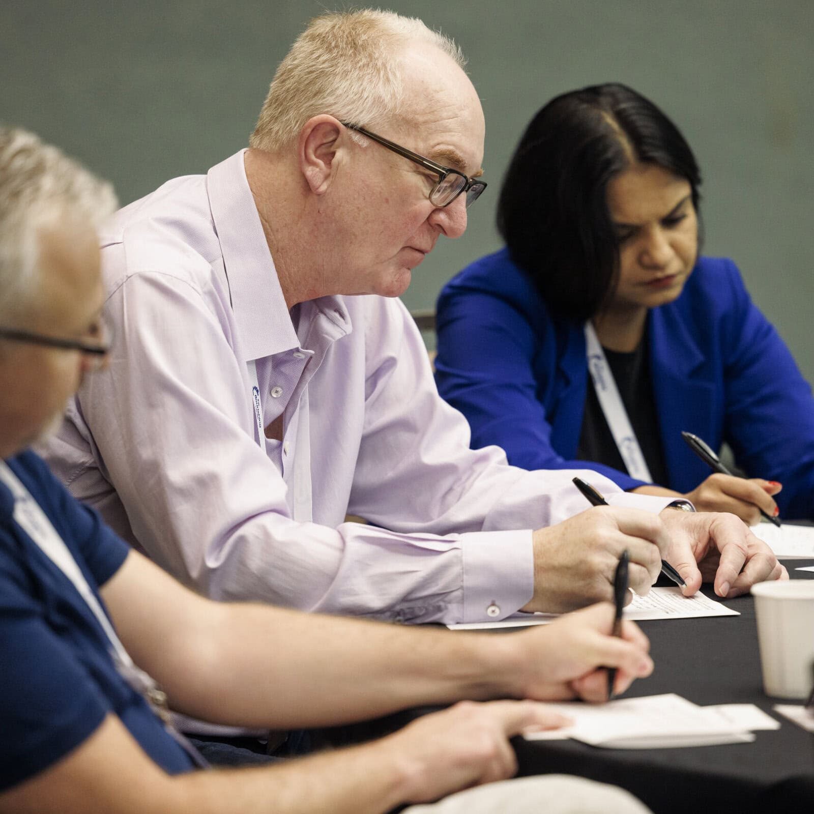 Speaker presenting at an ICF Coaching Week event, discussing the impact of coaching on personal and professional development.