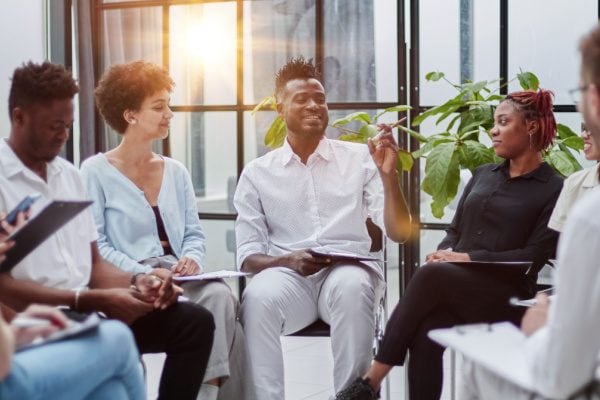 coach speaking during a group coaching session