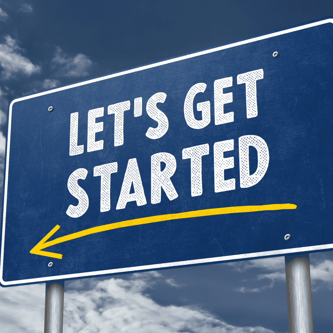 A lets get started sign pointing to the left with a sky background